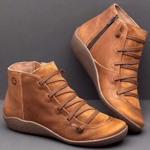 Botines para mujer con cierre lateral de cremallera y cintas elásticas cruzadas en marrón