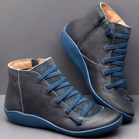Botines para mujer con cierre lateral de cremallera y suela azul con cintas elásticas cruzadas